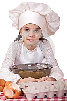 Cooking and people concept - smiling little girl in cook hat