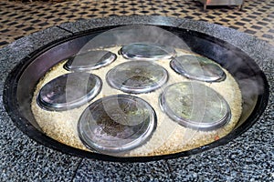 Cooking of plov in the Kazan cauldron at the Central Asian Plov Centre, Tashkent, Uzbekistan