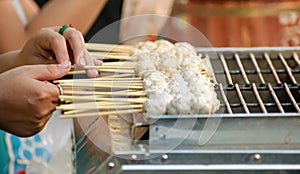 Cooking Pork Skewer Balls on a Grill