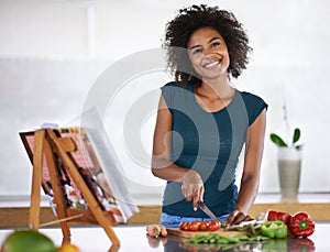 Cooking, portrait and happy woman chopping vegetables with recipe book in kitchen for healthy diet, nutrition or lunch