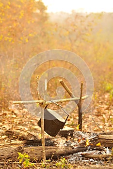 Cooking pot in campfire, Camping in forest