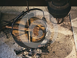 Cooking pot Wooden lid on stove Kitchen Traditional