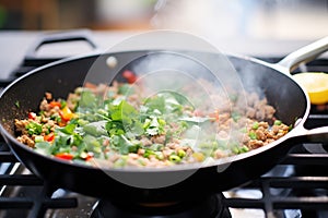 cooking process of chana masala in a skillet