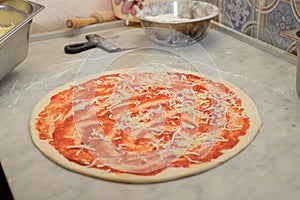 Cooking process of delicious pizzas at the pizzeria