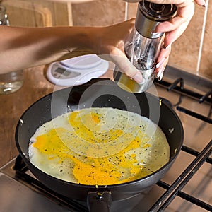 Cooking process of frying huge ostrich egg on frying pan