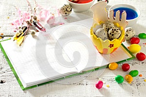Cooking recipe background for Easter celebration: quail eggs are, candy and twigs of willow