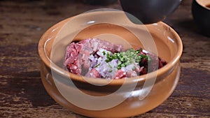 Cooking in restaurant, food video, slow motion. Close-up shot of male chef in black gloves preparing gourmet dish of