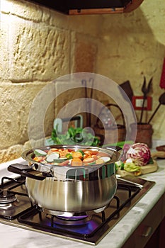 Cooking in rustic kitchen photo