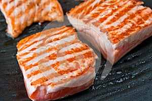 Cooking salmon steak on the grill