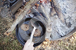 Cooking Sausage Over a Campfire