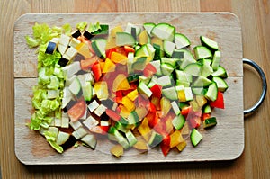 Home cooking from scratch concept with vegetables on a wooden board photo