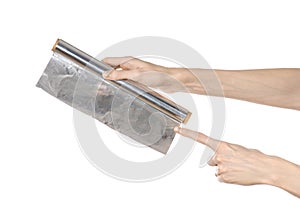 Cooking and shisha topic: human hand holding a foil isolated on