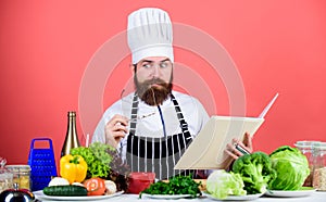 Cooking skill. Book recipes. According to recipe. Man bearded chef cooking food. Check if you have all ingredients. Cook