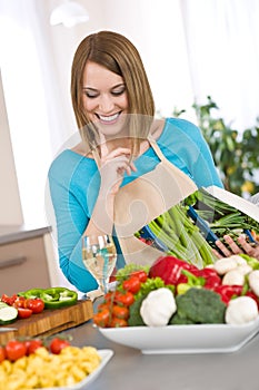 Cooking - Smiling woman holding cookbook photo