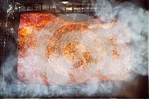 Cooking of a smoked salmon in a smokehouse