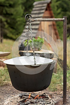 Cooking soup in a kettle on an open fire