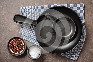 Cooking table with frying pans and spices