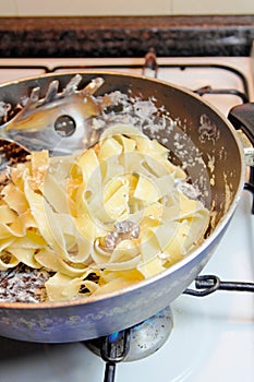 Cooking Tagliatelle Pasta photo