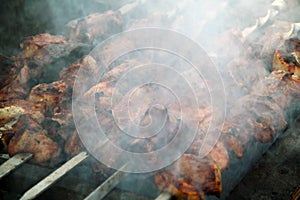 Cooking of tasty shashlick outdoors, closeup