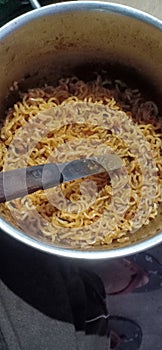 Cooking testful noddles in madhubani bihar india photo