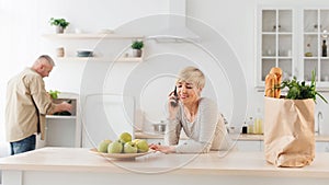 Cooking together in modern kitchen at home, couple after groceries shopping, supermarket food delivery