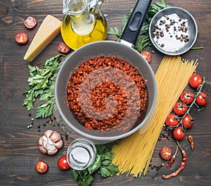 Cooking tomato paste with minced meat, cherry tomatoes, parsley, onion and garlic, butter, tomato paste and cheese, the ingredient
