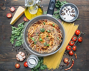 Cooking tomato paste with minced meat, cherry tomatoes, parsley, onion and garlic, butter, tomato paste cheese, the ingredient