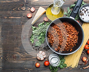 Cooking tomato paste with minced meat, cherry tomatoes, parsley, onion and garlic, butter, tomato paste cheese, the ingredient