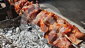 Cooking traditional Cyprus souvla with pork meat