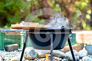 cooking traditional goulash in a 12 liter cauldron