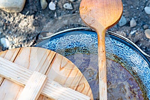 cooking traditional goulash in a 12 liter cauldron