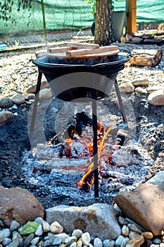 cooking traditional goulash in a 12 liter cauldron