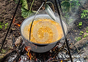 Cooking traditional Hungarian goulash soup