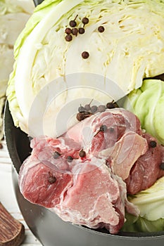 Cooking the traditional Norwegian dish of braised cabbage with l