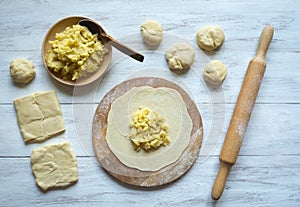 Cooking traditional pies with potatoes. Placinta, traditional Moldovan pastries