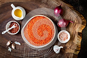 Cooking traditional red lentil Dal. Ingredients for Indian Dhal spicy curry.