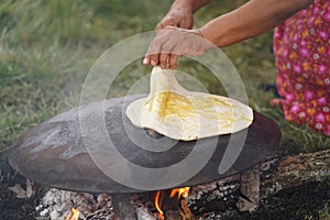 Cooking traditional Turkish borek, pide, pita or yufka bread