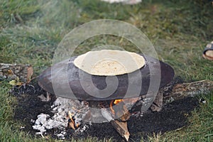 Cooking traditional Turkish borek, pide, pita or yufka bread