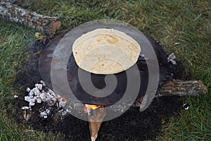 Cooking traditional Turkish borek, pide, pita or yufka bread