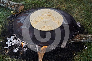 Cooking traditional Turkish borek, pide, pita or yufka bread