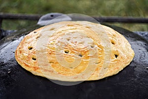 Cooking traditional Turkish borek, pide, pita or yufka bread