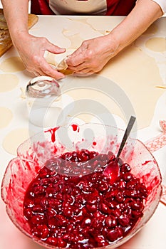Cooking ukrainian varenyky with cherries. Serie.