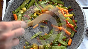 Cooking vegetables on frying pan in the kitchen. Healthy delicious food diet and meal plan for weight loss. Food from