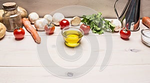 Cooking vegetarian food, fresh mushrooms, carrots and parsley oil potatoes border ,place for text wooden rustic background top