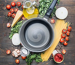 Cooking vegetarian pasta with cherry tomatoes, parsley, onion and garlic, butter, tomato paste cheese, the ingredients are lai