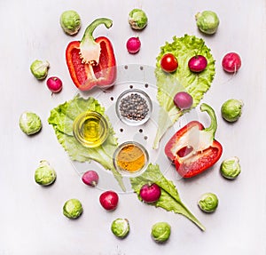 Cooking vegetarian peppers, lettuce, sprouts, seasonings on wooden rustic background top view