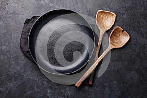 Cooking wooden utensils and empty plate