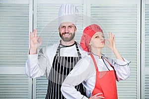 Cooking with your spouse can strengthen relationships. Reasons couples cooking together. Teamwork in kitchen. Couple
