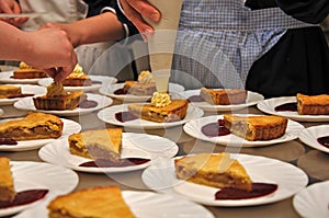 Cooks adding cream to delicious homemade apple pies