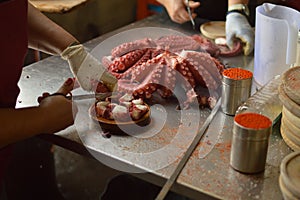 Cooks Chopping Octopus At Becerrea Octopus Fair. Cooking, Food, Travel, Professions, jobs